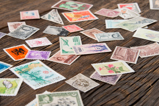 Postage stamps on the table. Philatelism Collection of postage stamps. Postage stamps on the table. Philatelism stamp collecting stock pictures, royalty-free photos & images