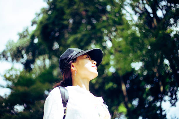 istock Japanese woman walking in nature 823255804