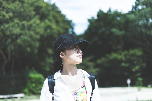 istock Japanese woman walking in nature 823255944
