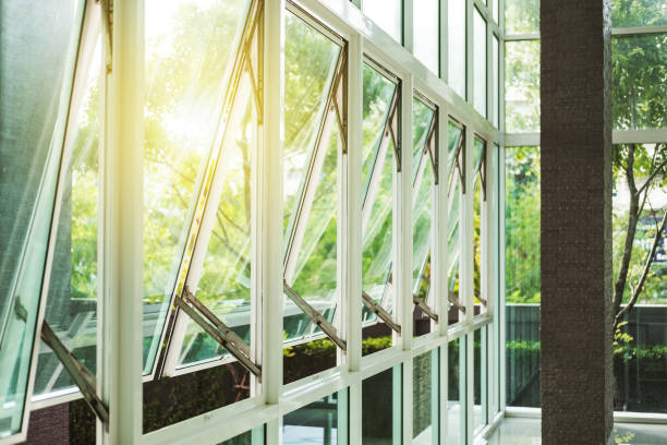 istock Modern office building wall and opened window in the morning 823256892