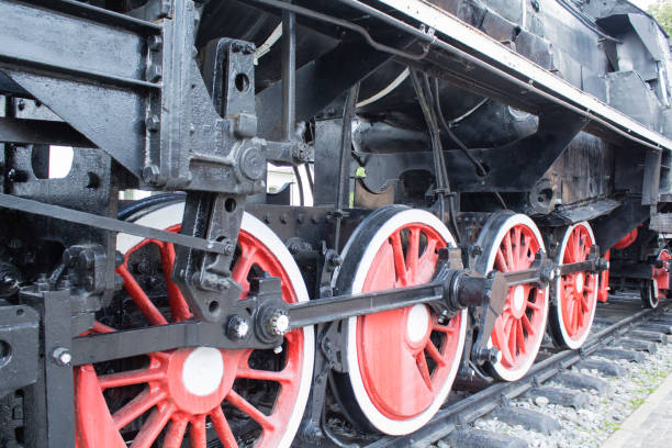 istock Old locomotive wheels close up 823256908