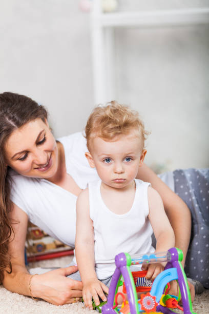 istock mother and her son play together indoor 823263006