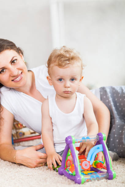 istock mother and her son play together indoor 823263080