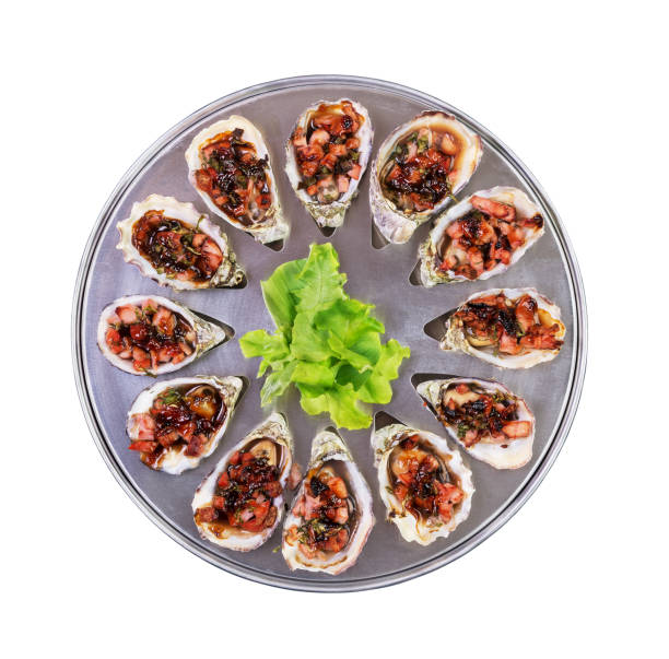 dozen oven baked oysters kilpatrick isolated top view