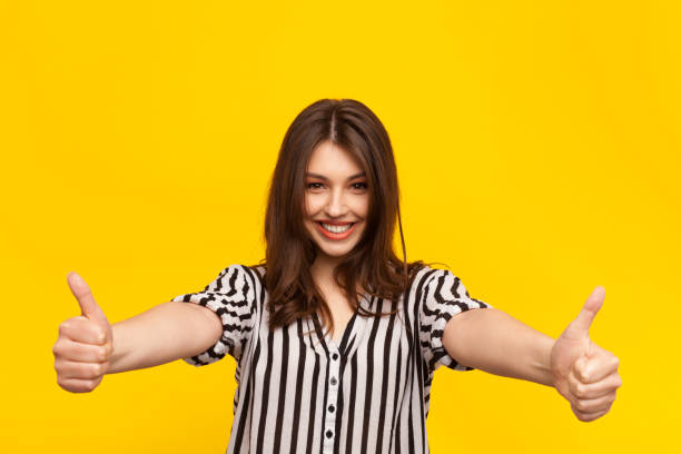 istock Cheerful model holding thumbs up 823268620