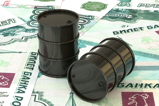3d illustration: Golden barrels of oil lie on the background of ruble, rouble money. Petroleum business, black gold, gasoline production. Purchase sale, auction, stock exchange. Russian government.