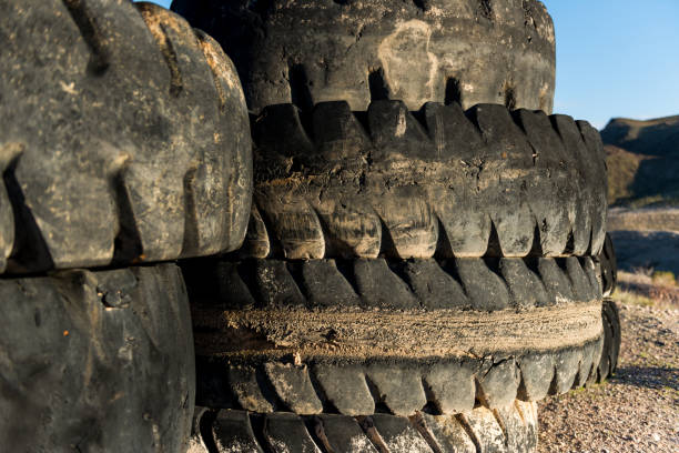 istock Giant tires in lake bed left to rot 823271490