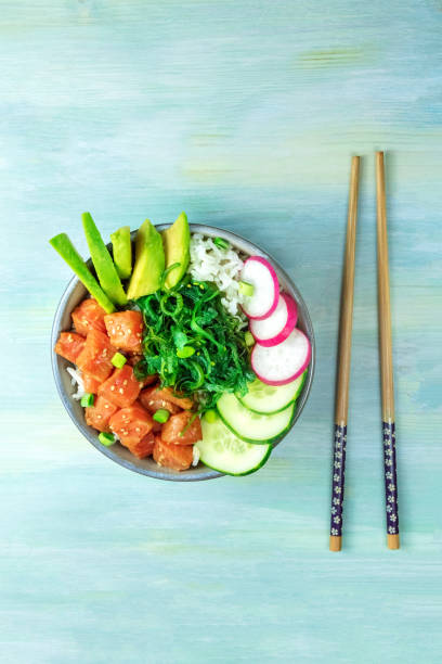 istock Hawaiian salmon poke salad with chopsticks and copy space 823272142