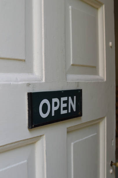 istock Open sign on white door. 823289272