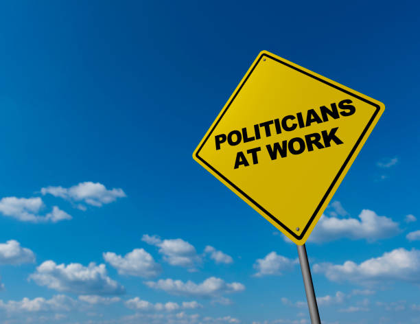 istock POLITICIANS AT WORK  - Road Warning Sign 823291654