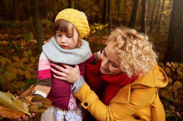 istock Collecting leaves in autumn forest 823292372