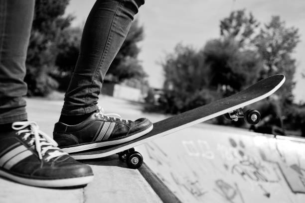 istock young man skateboarding, in black and white 823297066