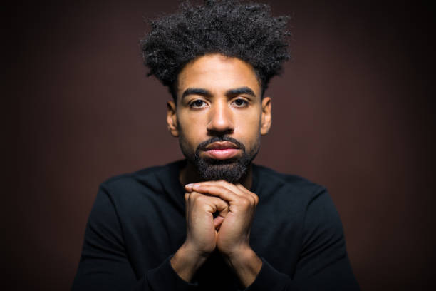istock Portrait Of Serious Man With Hands Clasped 823300036