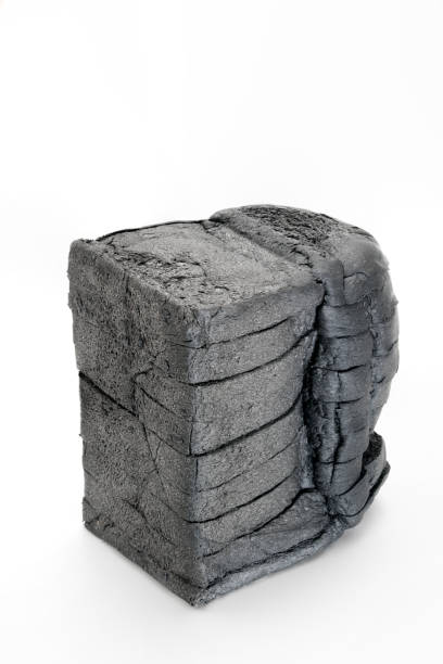 istock loaf slide of charcoal bread black bread isolated on white 823304484