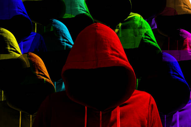 istock Group of differently colored hooded hackers cybersecurity concept 823310616