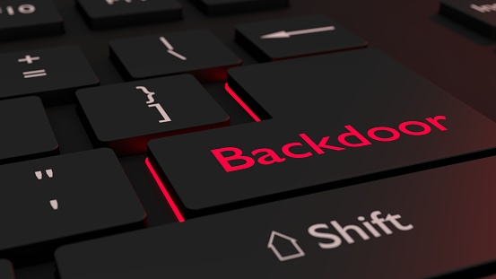 Black keyboard where the enter key is glowing red showing the word backdoor cybersecurity concept 3D illustration