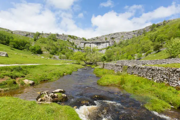 Malham Cove Yorkshire Dales National Park England UK popular tourist attraction in summer