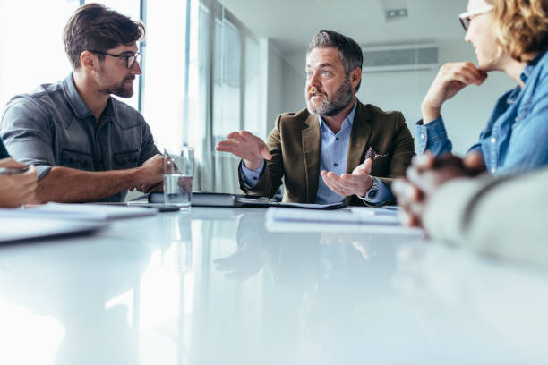 istock Businessman explaining new business ideas to colleagues 823320248