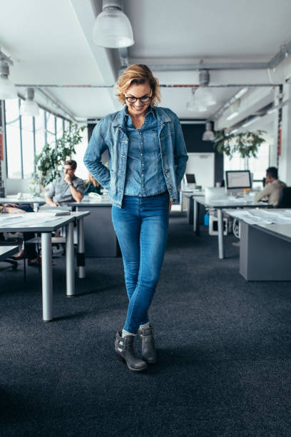istock Businesswoman standing in office and looking down 823322106
