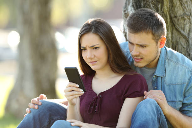 istock Worried couple seeing content in a smart phone 823326438