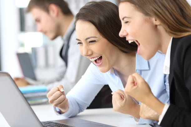 istock Excited executives reading on line news 823326728