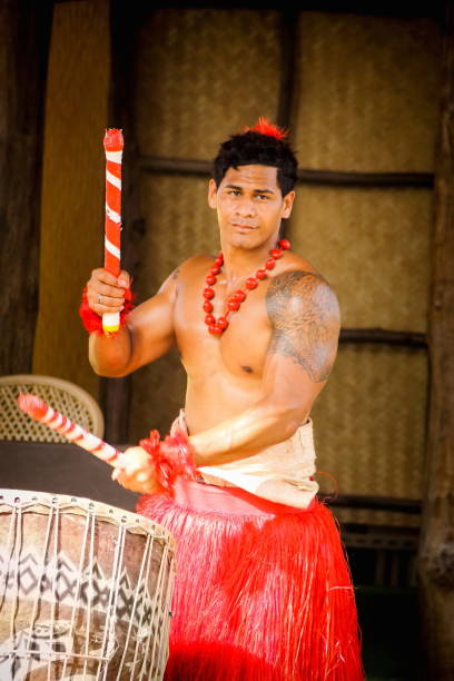A Tongan man playing drums stock photo