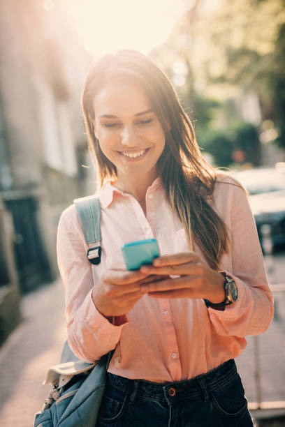istock Woman texting in the city 823335516