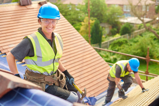 istock female roofer replacing roof tiles 823335694