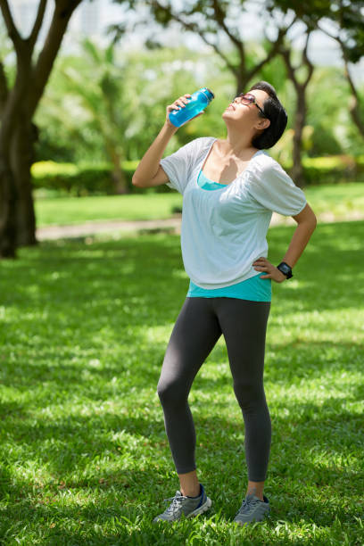 istock Woman Refreshing during Outdoor Workout 823335768