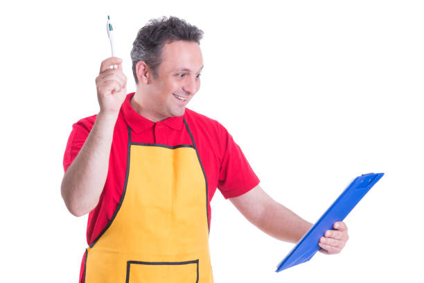 istock Store employee reading inventory list on clipboard 823338944