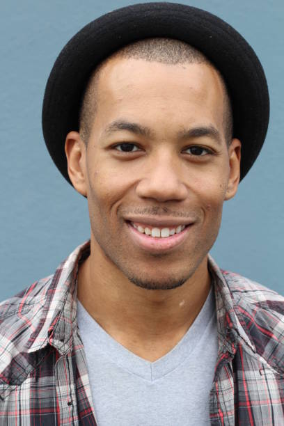 istock Hip man wearing a Fedora hat smiling 823339710