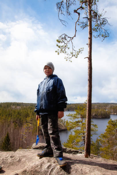 istock The boy walks through the woods in Finland 823347876