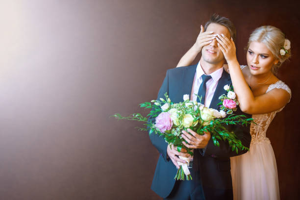 istock bride closes to groom's eyes 823348924