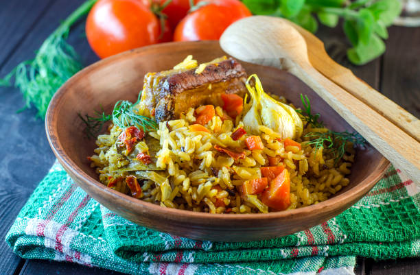 istock Pilaf on a platter with meat and spices 823349144