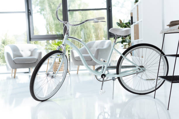 istock interior of empty creative office with bicycle and white chairs 823350048