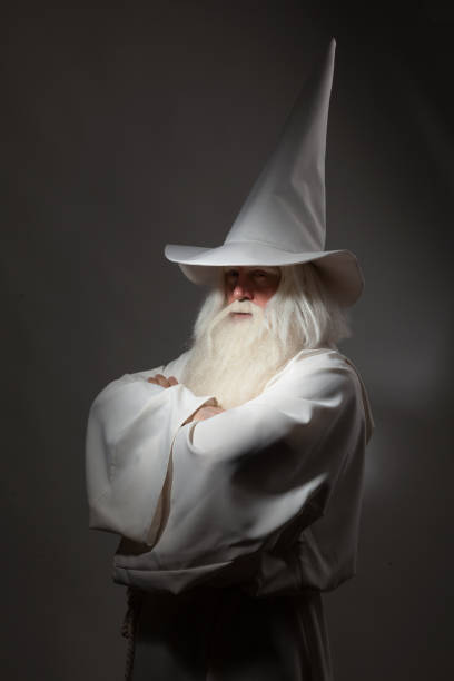 istock Man in sorcerer costume on white background 823350050