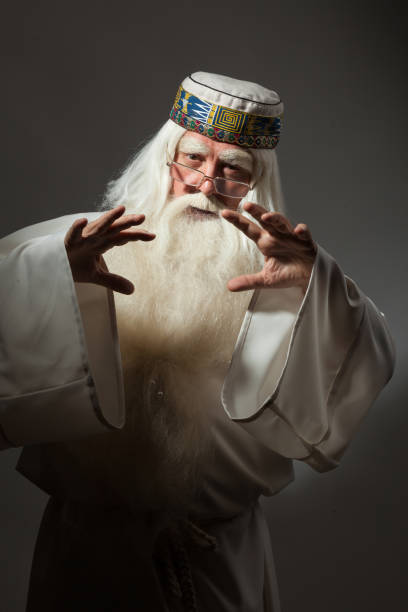 istock Man in sorcerer costume on white background 823350182