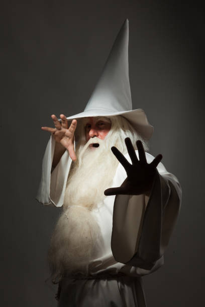 istock Man in sorcerer costume on white background 823350246