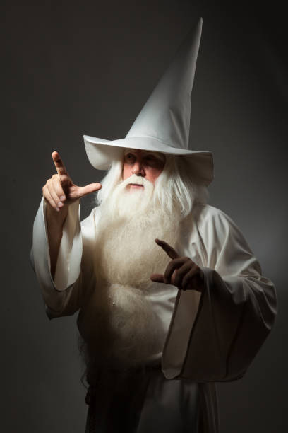 istock Man in sorcerer costume on white background 823350472