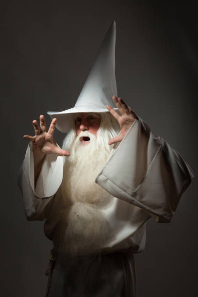 istock Man in sorcerer costume on white background 823352718