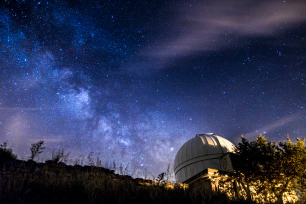 milkyway in the night over a telescope observartory