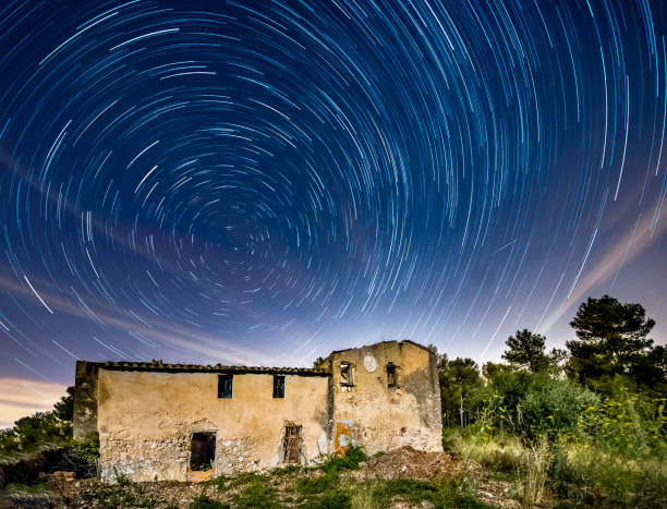 istock circumpolar startrails over abandoned house 823356462