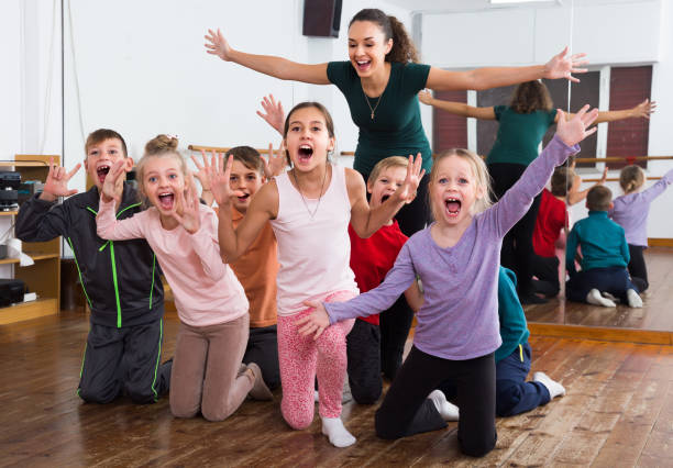 istock Cheerful children  in dance studio having fun 823358234
