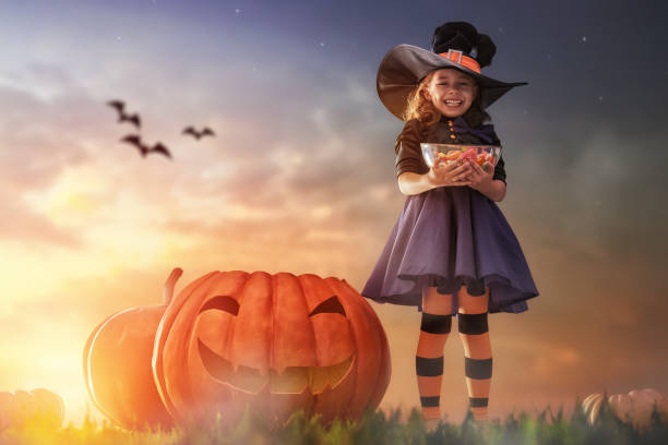 istock little witch outdoors 823361078