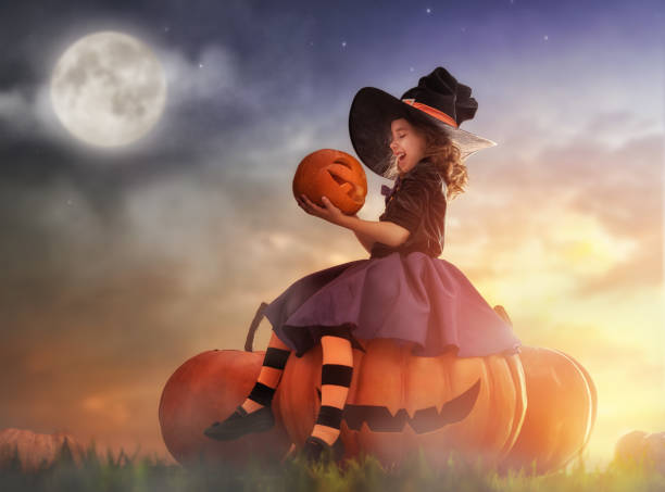istock little witch outdoors 823361084
