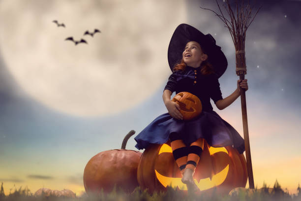 istock little witch outdoors 823361088