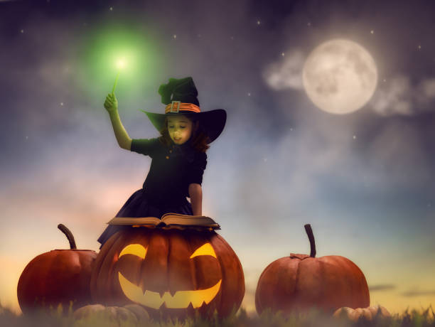 istock little witch outdoors 823361116