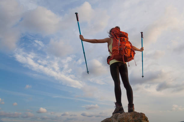 istock Successful woman backpacker enjoy the view at mountain peak 823361154