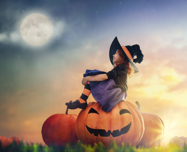 istock little witch outdoors 823361158