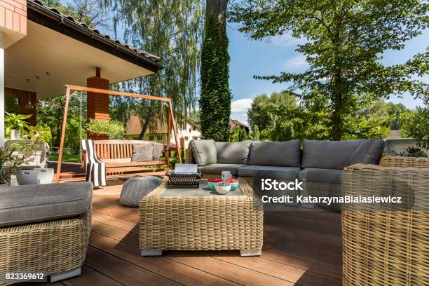 Cozy Terrace With Wicker Furniture Stock Photo - Download Image Now - Clear Sky, Contented Emotion, Cozy